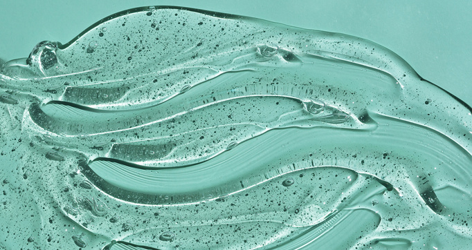 Transparent cream gel cosmetic background. Hyaluronic acid cosmetic gel. Skin care product.